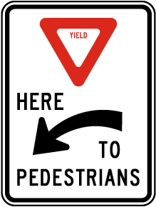 Yield Here to Pedestrians Sign